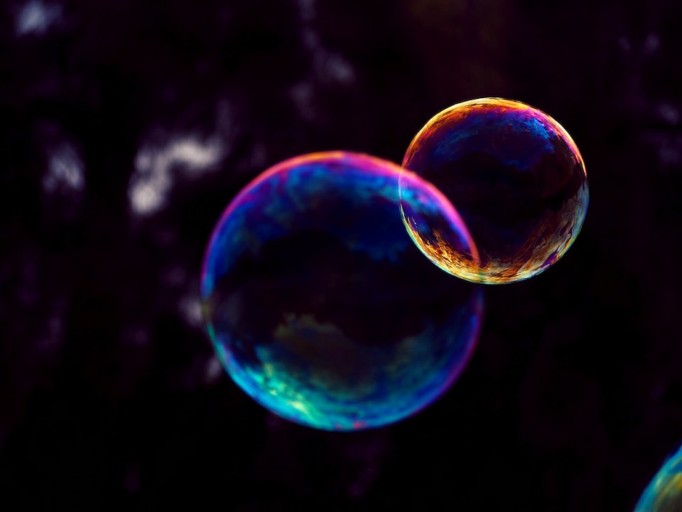 Two bubbles with a dark background.